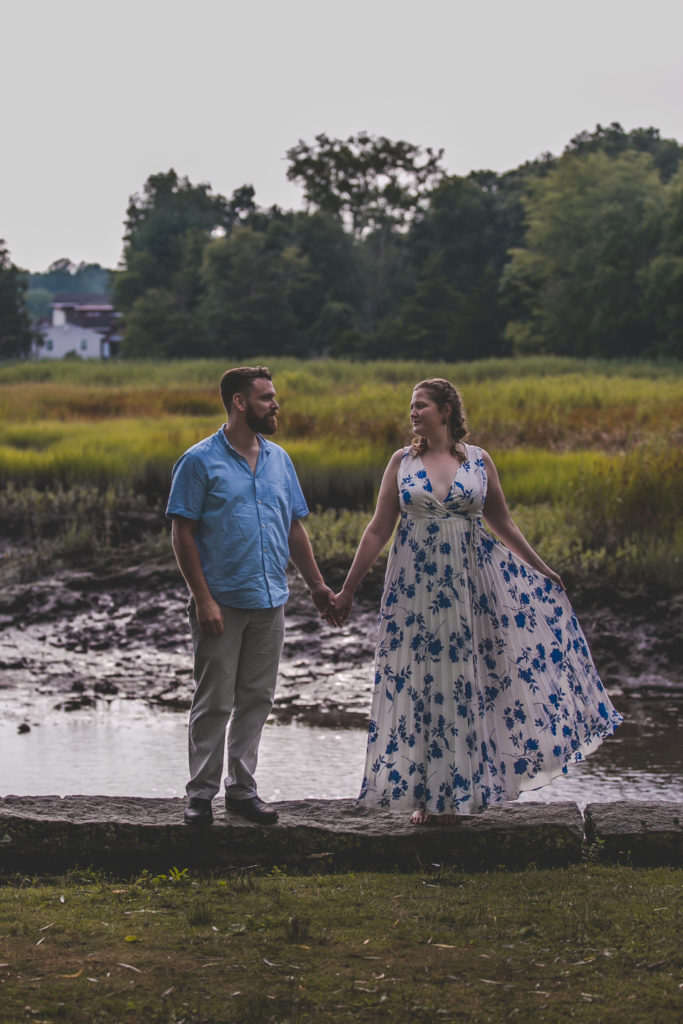 blue floral dress, summer engagement session, summer photo shoot, outdoor engagement session, moody engagement session, moody engagement photos, moody engagement photo session, film style engagement session, film style engagement photos, film engagement shoot, film engagement photos, whimsical engagement shoot, coastal engagement session, costal engagement photos, beach engagement, park engagement, moody engagement, candid engagement, Brandford, CT, Guildford, CT, Connecticut photos, Connecticut Engagement, CT Engagement